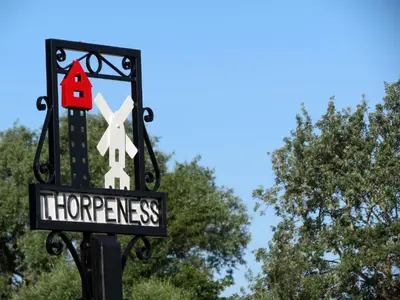 a sign for at Ogilvie Lodge Apartment in Thorpeness