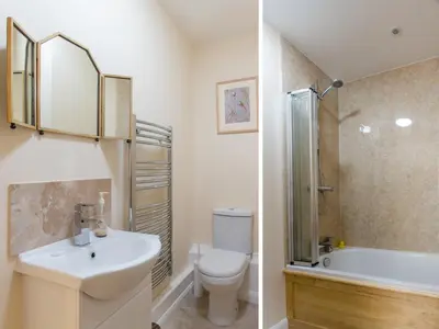 a bathroom with a toilet sink and a shower at The Retreat, Unique property located in calming woodland surroundings, Close to Aldeburgh and Thorpeness in Leiston