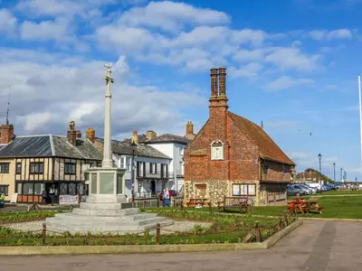 an old building with a cross on top of it at 17 Britten Close - Aldeburgh Coastal Cottages in Aldeburgh