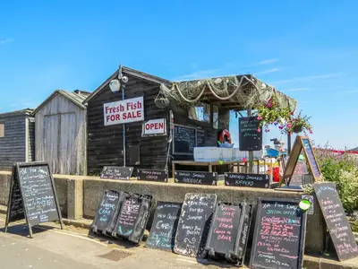 a fast food restaurant with signs in front of it at 17 Britten Close - Aldeburgh Coastal Cottages in Aldeburgh