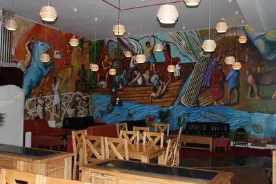 a large mural on the wall of a restaurant at Desalis Hotel London Stansted in Elsenham