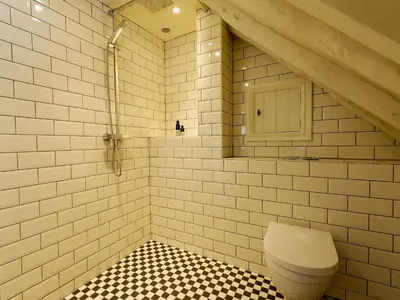 a bathroom with a white toilet in a room at The Dairy - Ukc1546 in Heveningham