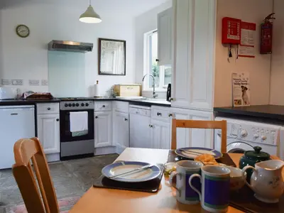 a kitchen with a table with plates on it at Millers Rest in Willingham