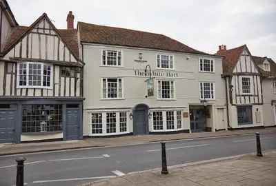 a white building on the side of a street at White Hart Hotel by Greene King Inns in Coggeshall