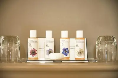 a group of four bottles of moisturizers on a shelf at The Westleton Crown in Westleton