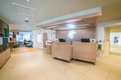 a lobby of an office with a reception desk at Holiday Inn Brentwood by IHG in Brentwood