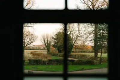 a view of a field from a window at Fanhams Hall, Exclusive Collection in Ware