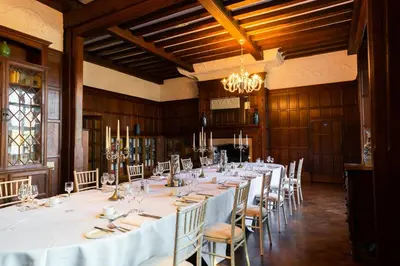 a large room with a long table and chairs at Fanhams Hall, Exclusive Collection in Ware