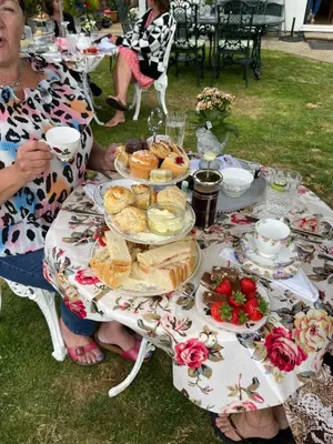a table with plates of food on it at Southend Airport Bed & Breakfast in Rochford