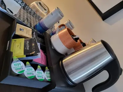 a metal trash can sitting on top of a desk at Belle Vue Guest House in Denver
