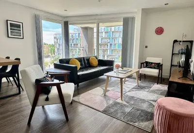 a living room with a couch and a table at Signet Apartments - Ceres in Cambridge