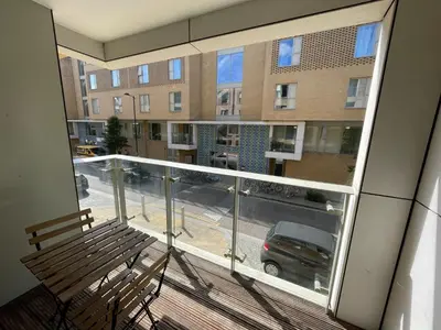 a balcony with a bench and a view of a street at Signet Apartments - Vesta in Cambridge
