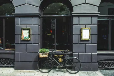 a bike parked in front of a building at Hertford House in Hertford