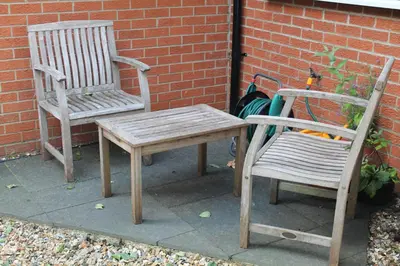 two chairs and a wooden table and a chair at Pear Tree House Studio in Ely