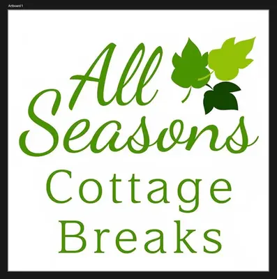 a sign that reads all seasons conference breaks with leaves at All Seasons Cottage Breaks in Saxmundham