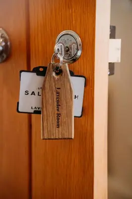a lock with a price tag on a door at Creeksea Place Barns in Burnham on Crouch