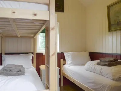 a bedroom with two bunk beds and a window at Wilby Halt-Ukc712 in Wetheringsett