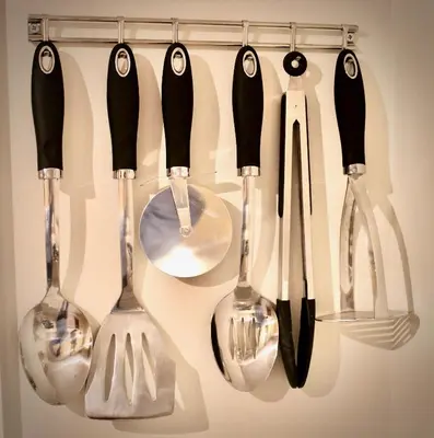 a group of utensils hanging on a rack at Mathus Gardens in Cambridge