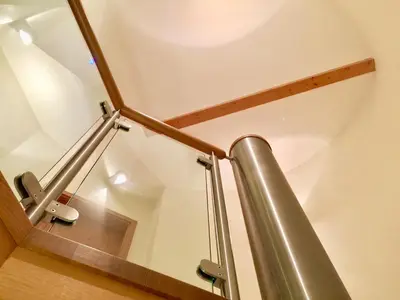 a staircase with a metal rail and a metal railing at Laurels in Felsted