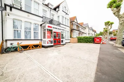 an empty parking lot in front of a building at Devine Beach Hotel, Westcliff Southend-On-Sea in Southend-on-Sea