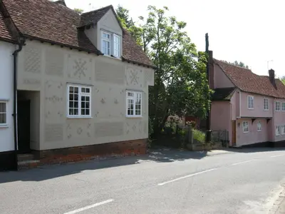 a house with white paint on the side of a street at Motts Bed & Breakfast in Great Dunmow