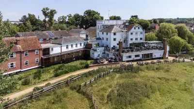 an aerial view of a village with a building at The Mill Hotel Sudbury in Sudbury