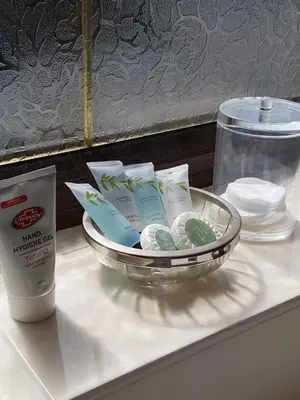 a counter with a bowl of toothpaste and a container of tooth paste at Byerley House in Newmarket