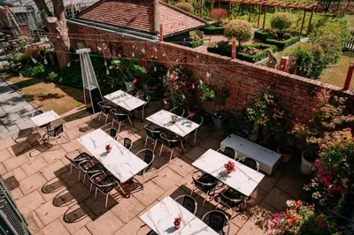 an overhead view of a patio with tables and chairs at B&B Downham Hall in Wickford