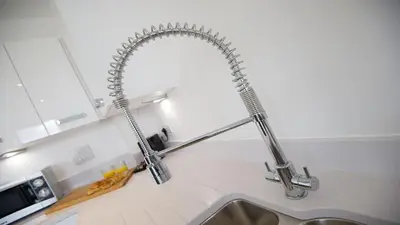 a kitchen sink with a stainless steel faucet at Tailored Stays - De Havilland House in Cambridge