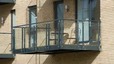 a balcony on the side of a brick building at Tailored Stays - De Havilland House in Cambridge