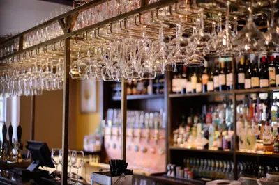 a bunch of wine glasses hanging over a bar at The White Horse in Hertingfordbury