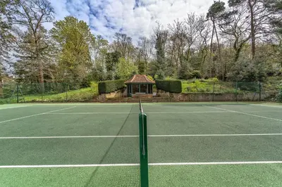 a tennis court with a gazebo on it at The Dairy in Freston