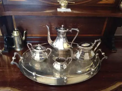 a tray with two tea pots and pans on a table at The Crown Hotel in Mundford