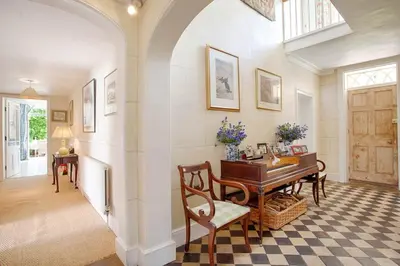 a home office with a desk and a table at Vicarage House & Pool House in Hockham