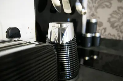 a coffee cup sitting on top of a counter at Apartments at Number 10 The Abbey in Norwich