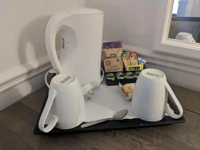 two white appliances are sitting on a tray at Best Western Ipswich Hotel in Ipswich