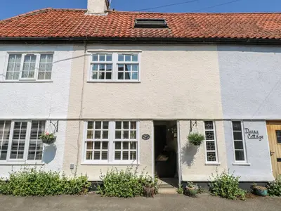 a white and blue house with a red roof at Peggotty's in Kelsale