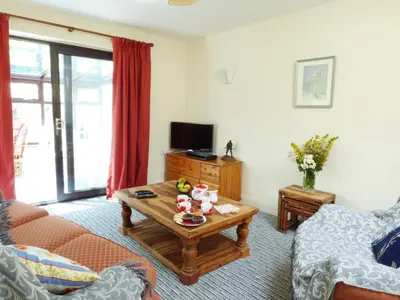 a living room with a couch and a coffee table at 27 Swan Street in Boxford