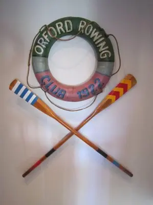 two hockey sticks and a sign with the word second round at Crown Cottage, Orford - Prime Orford Location in Orford
