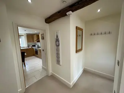 a room with a hallway with a wall at Meadows Barn in Chelmsford