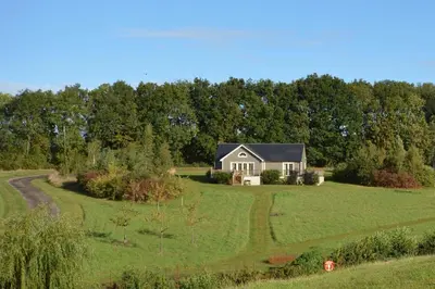 a house in the middle of a field at Campion Lodge in Chappel