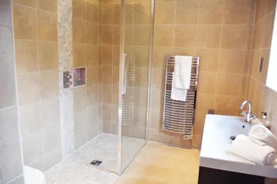 a bathroom with a shower and a sink at Woodbell Lodge in Chappel