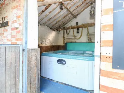 a washer and dryer sitting inside of a building at The Barn in Ashill