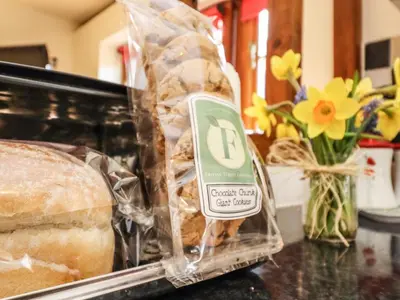 a loaf of bread in a plastic bag on a counter at Poppy Cottage in Little Glenham