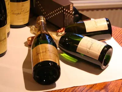 two bottles of wine sitting on top of a table at The Black Bull Inn in Balsham