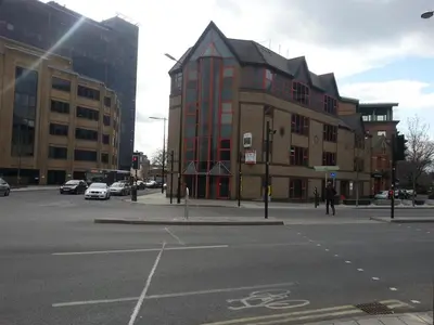 an intersection of a street with a large building at Observation Court in Ipswich