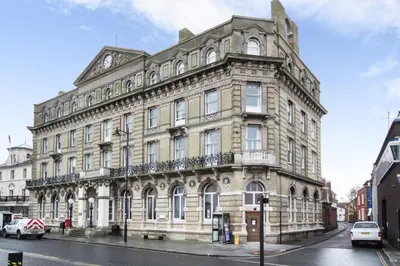 a large stone building on a city street at On the Quay in Harwich