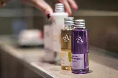 a counter with three bottles of essential oils on it at Crown and Castle in Orford