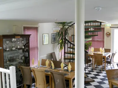 a dining room with a table and some chairs at Richmond Park Golf Club in Watton