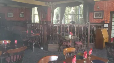 a restaurant with tables and chairs in a room at Rose and Crown Hotel in Haverhill
